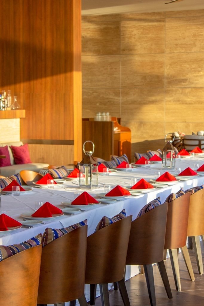 A long table laid out for a catered event